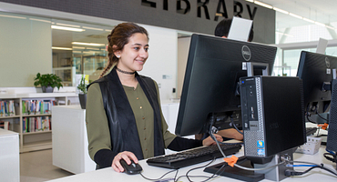 Student at a computer in the library